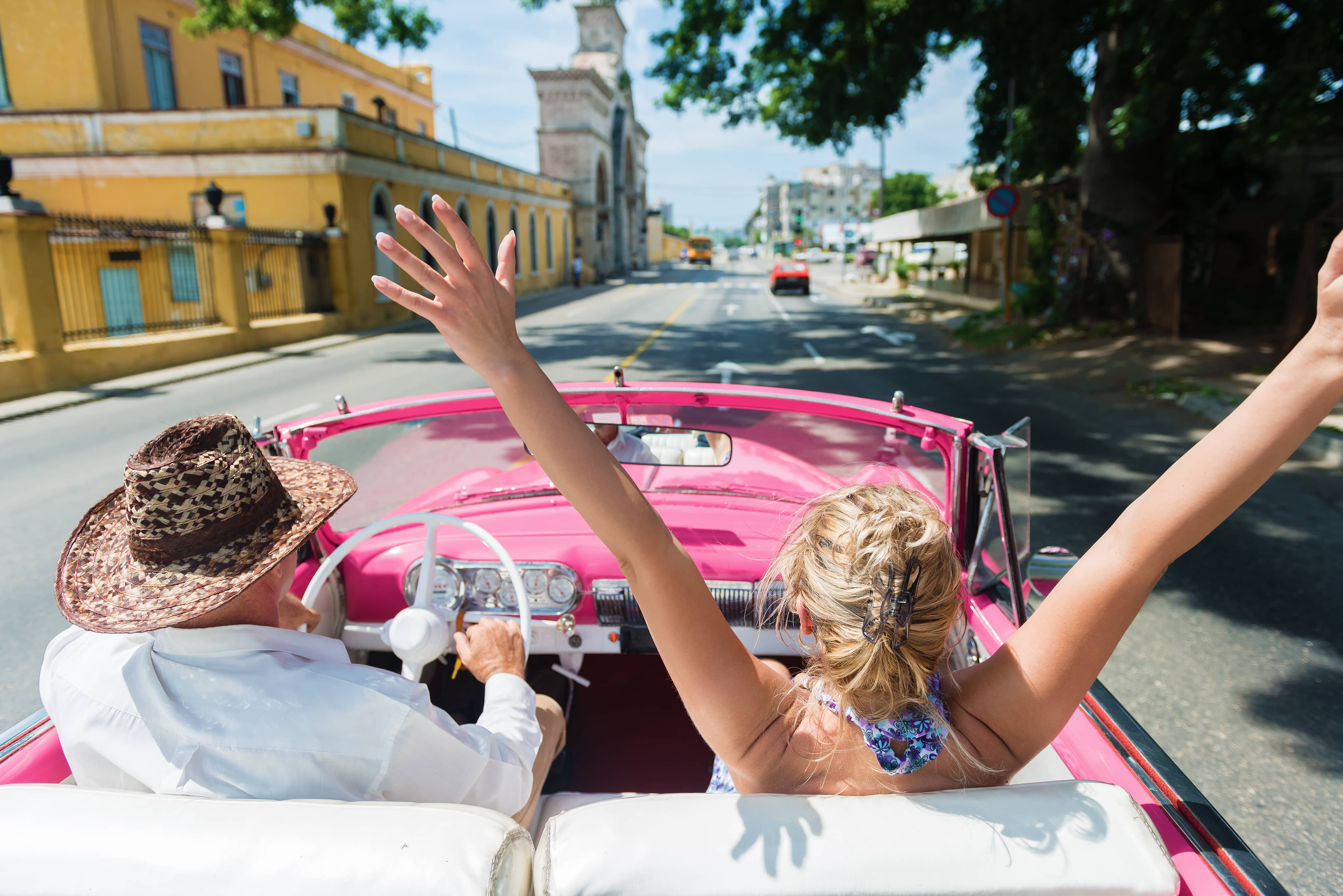 Medical Conditions That Prevent You From Flying: Couple driving in Cuba