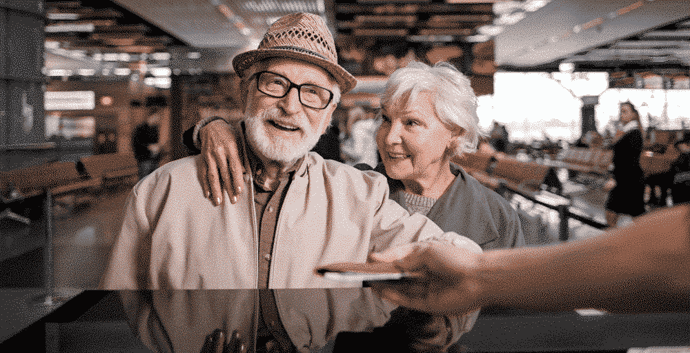 Holiday Ideas & Destinations For Older Couples: Old couple at airport