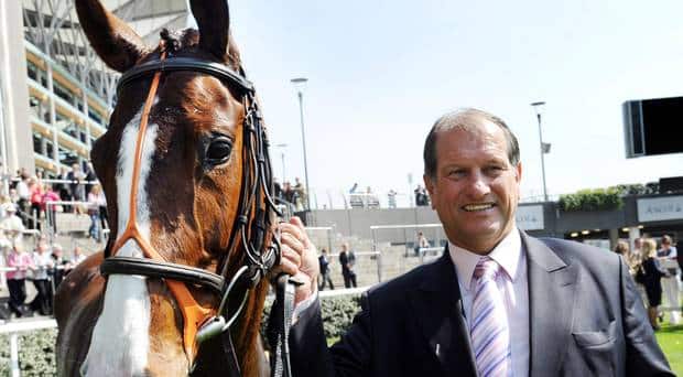 How Bob Champion overcame life's hurdles with AllClear Travel Insurance; Bob Champion guiding horse at race