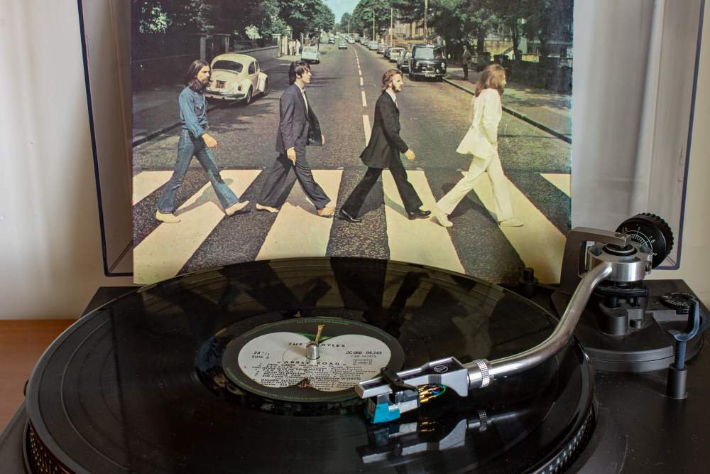 Celebrating the 50th Anniversary of The Beatle's Abbey Road Album: The album Abbey Road playing on vinyl next to the cover