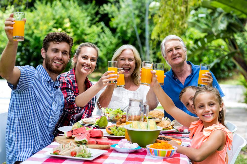 Organic September: multi generational family having outside meal