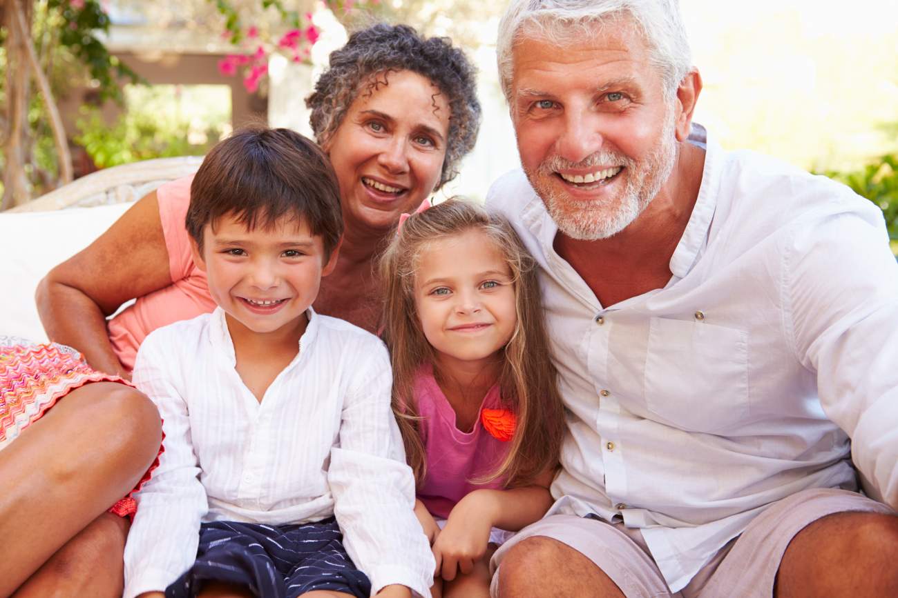 Tips for Travelling with Grandchildren: grandchildren on holiday with parents taking a selfie