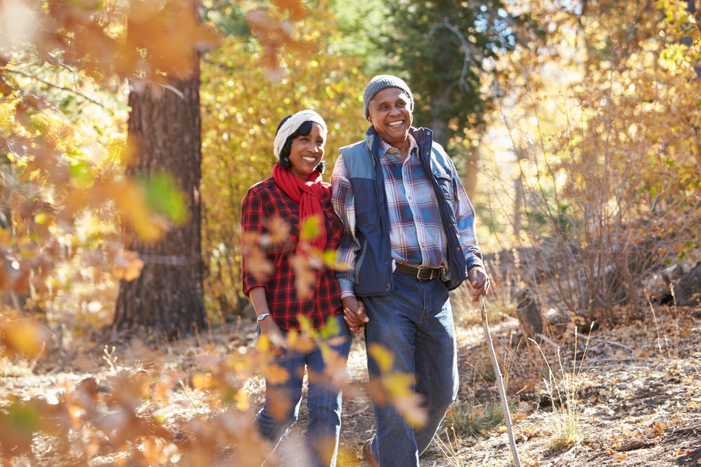 The best reasons to holiday abroad at Christmas: mature couple hiking in sun