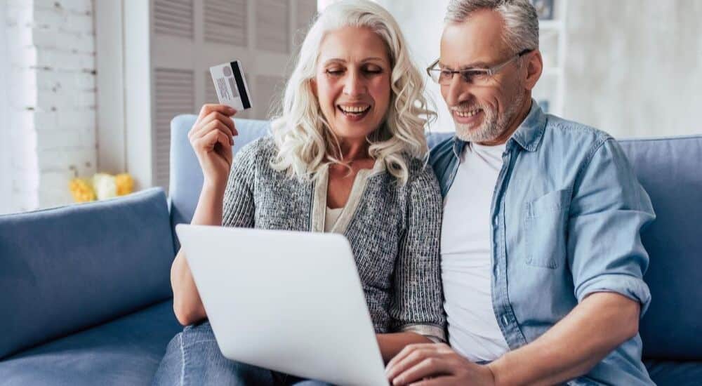 Couple Thinking About The Pros and Cons of Travel Reward Cards | AllClear Travel Blog Couple Thinking About The Pros and Cons of Travel Reward Cards | AllClear Travel Blog