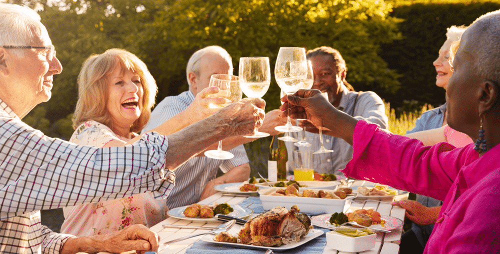 friends having dinner in the sunshine