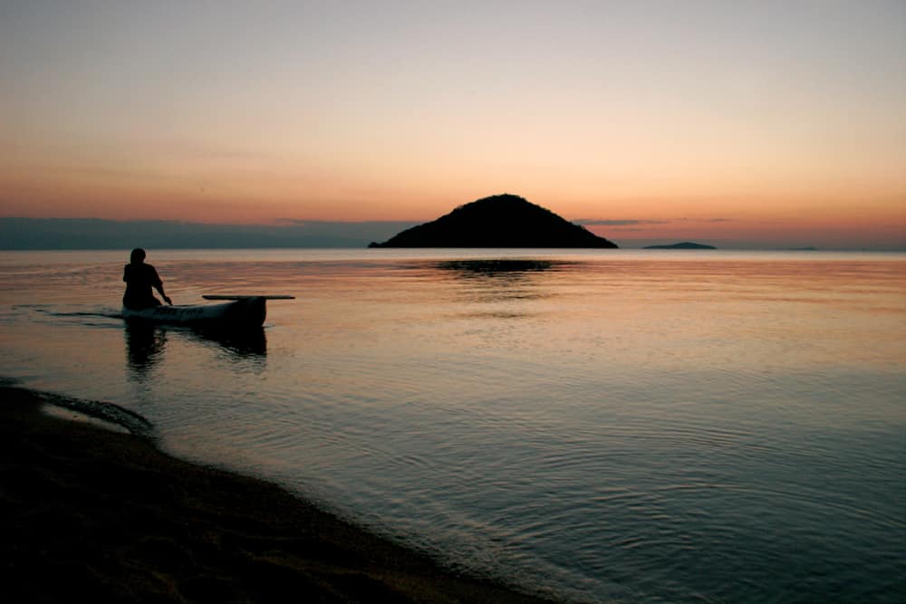 The best Autumn holiday destinations: Main on boat in Malawi