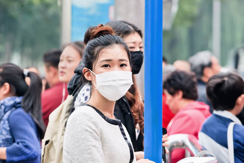 Top 5 injuries to avoid on holiday: Woman wearing mask china